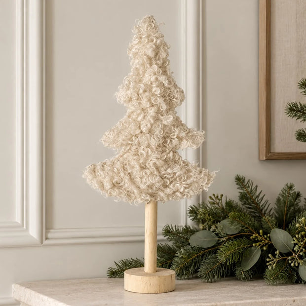 Tall Boucle Cream Tree With Wood Base, cream boucle tree on a wooden base beside greenery