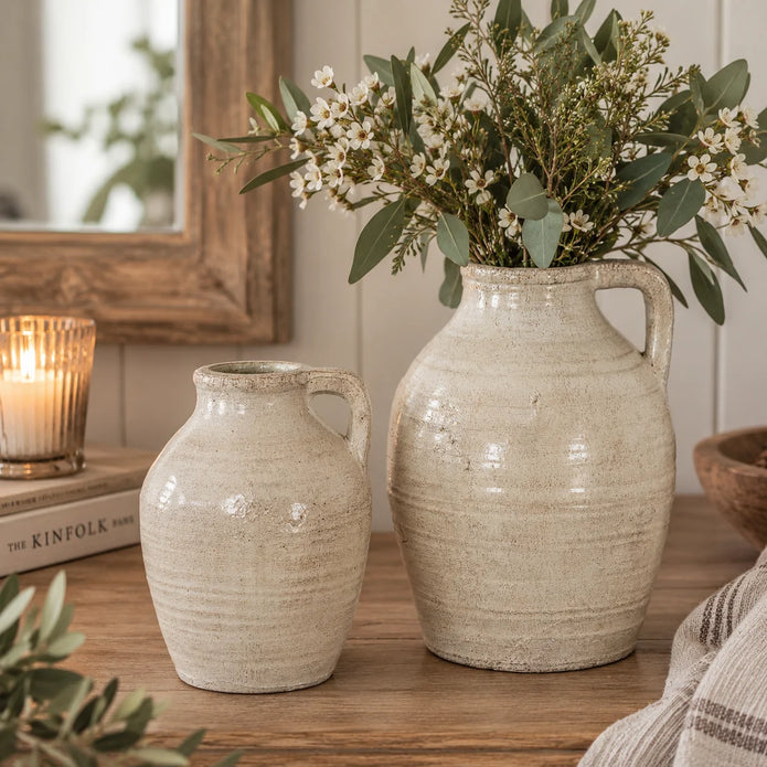 Medium and large Tarn decorative handled jugs with textured cream glaze styled with white flowers