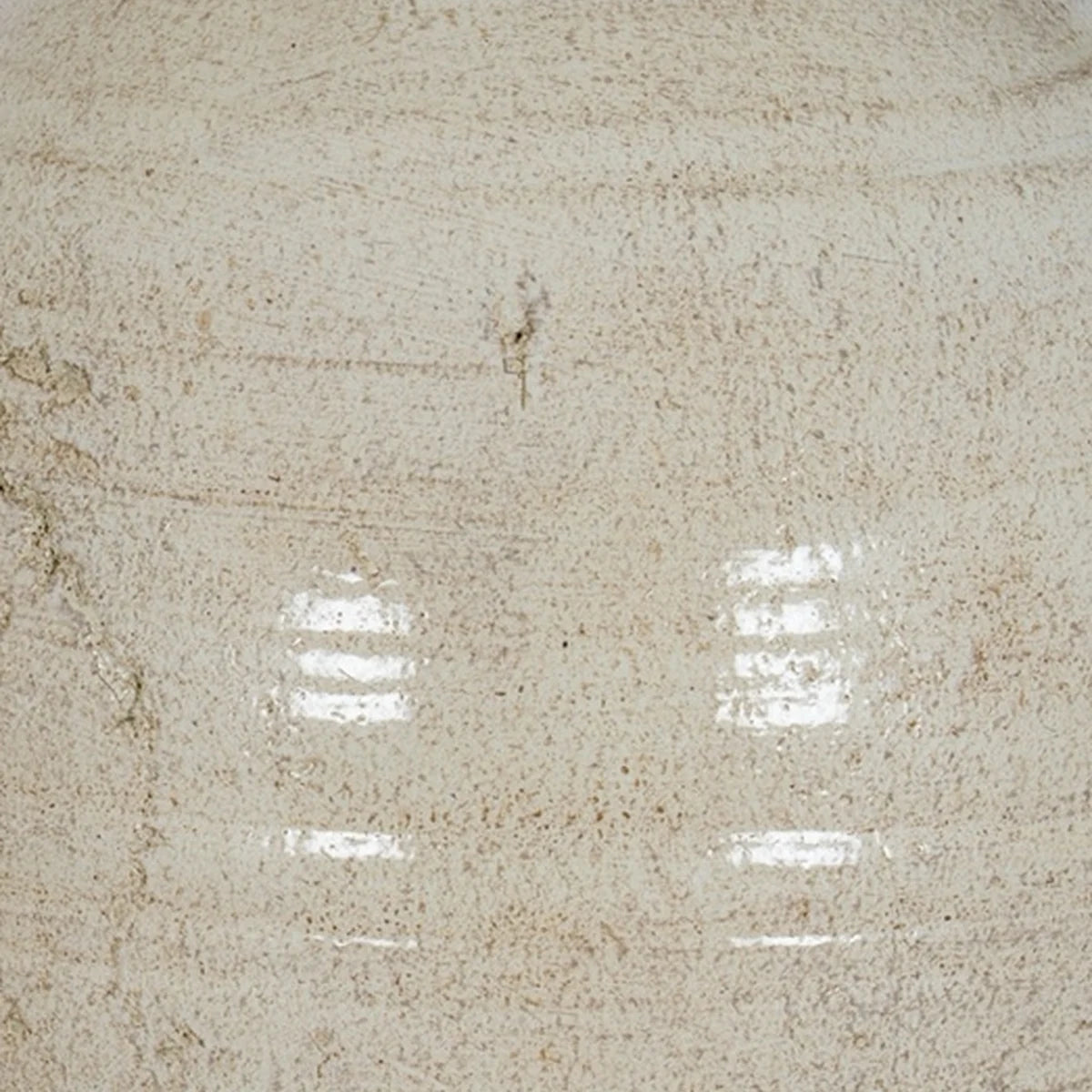 Close-up of Tarn neutral glazed jug textured stone cream finish and curved ceramic handle