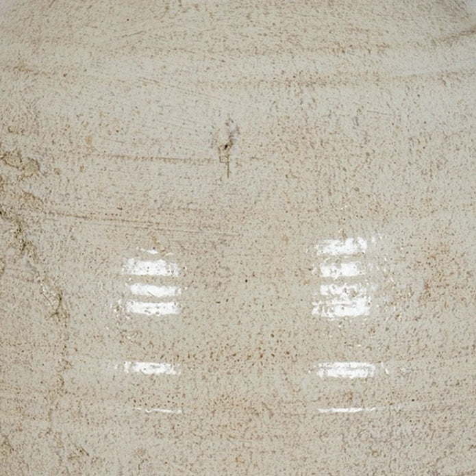 Close-up of Tarn neutral glazed jug textured stone cream finish and curved ceramic handle