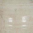 Close-up of Tarn neutral glazed jug textured stone cream finish and curved ceramic handle