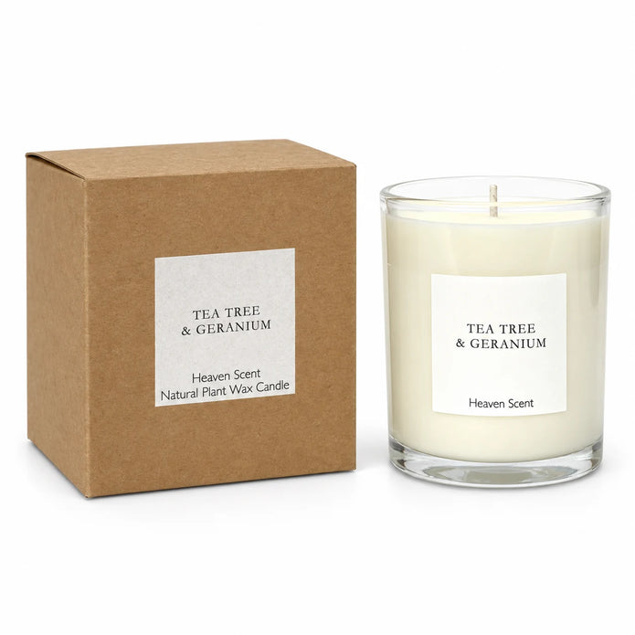 Heaven Scent Tea Tree And Geranium Medium Candle, unlit with its brown kraft box against white