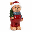 Detailed studio view of the red Christmas teddy bear and its green tree