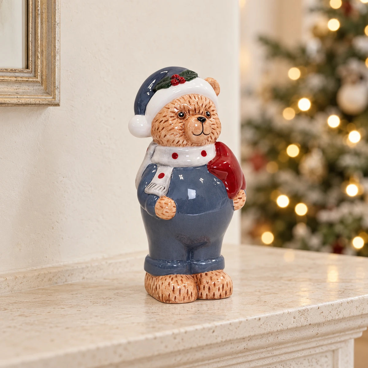 Winter blue teddy bear Christmas ornament on a limestone mantel