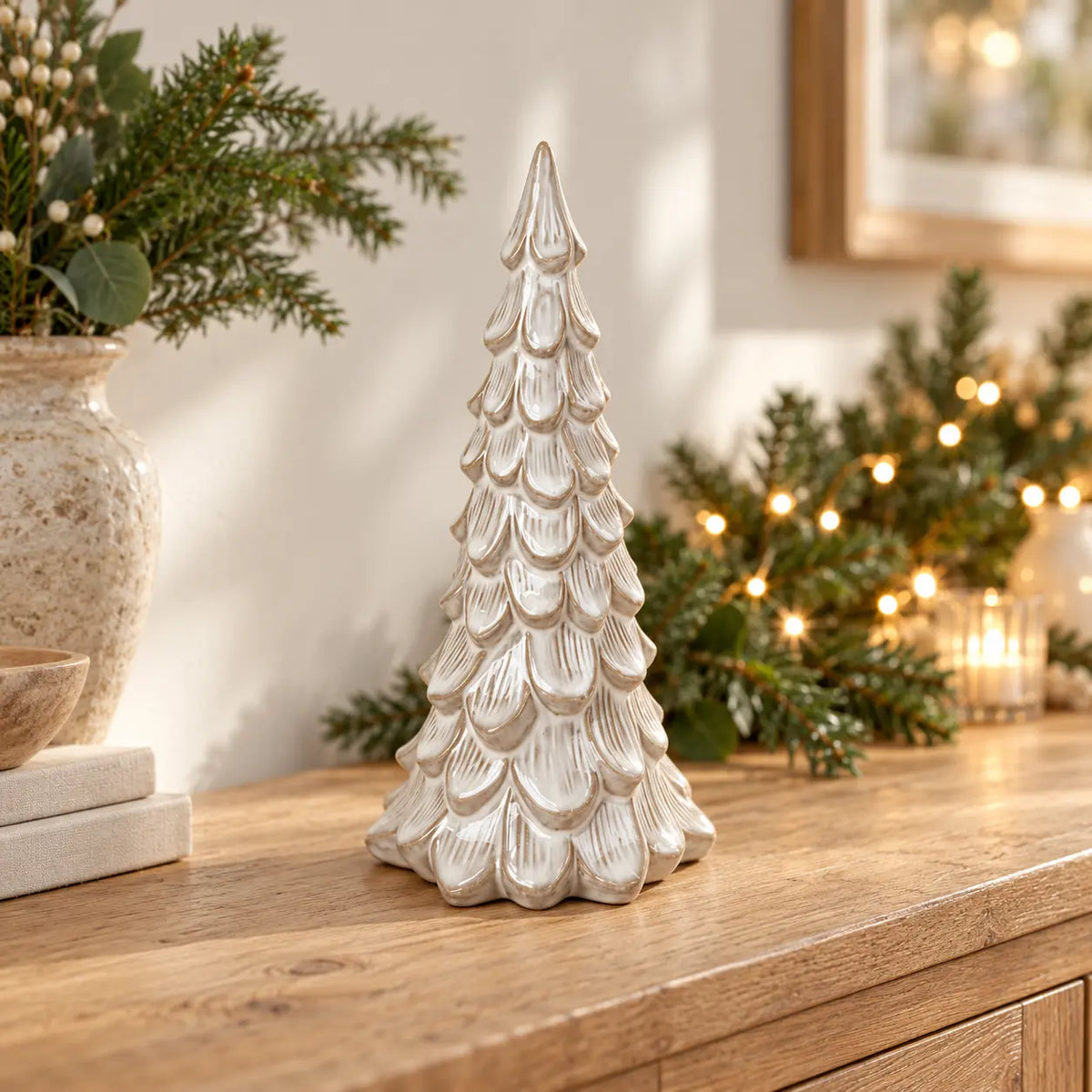 Large Satchville glazed ceramic Christmas tree ornament with textured detail on a console table