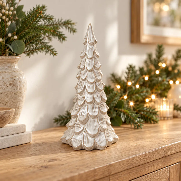Large Satchville glazed ceramic Christmas tree ornament with textured detail on a console table