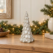 Satchville medium glazed ceramic Christmas tree ornament with textured detail on a console surface