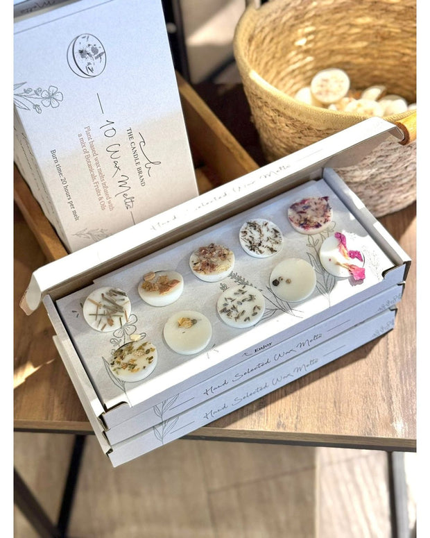 Gift box of ten assorted wax melts from The Candle Brand Ltd, featuring a variety of scented wax melts in a decorative box.