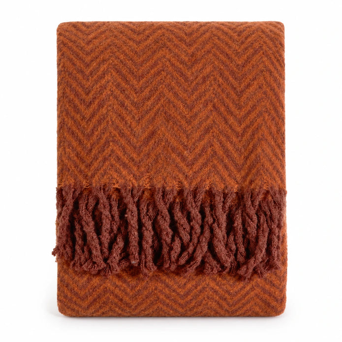 Tweedie cinnamon brushed herringbone throw folded with fringe on a white background