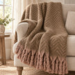 Tweedie mocha brushed herringbone throw styled on an oatmeal armchair
