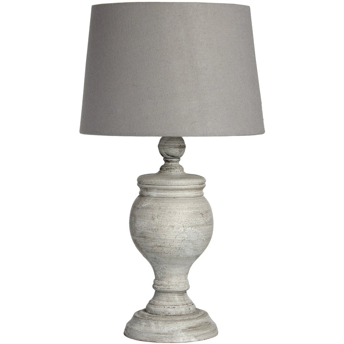 Uthina wooden table lamp by Hill Interiors featuring a sleek, natural wood finish and modern lighting design on a table surface.
