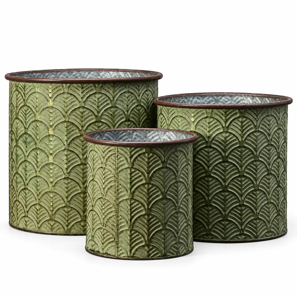 Three empty vintage green cylindrical metal planters with embossed leaf patterns and brown rims on white