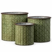 Three empty vintage green cylindrical metal planters with embossed leaf patterns and brown rims on white