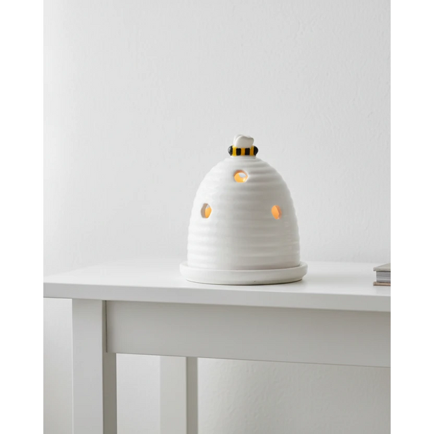 White beehive tealight holder for wax melts, decorative home fragrance burner with intricate hive design.