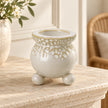 White Bobble Candle Holder — Empty holder on pale stone mantel