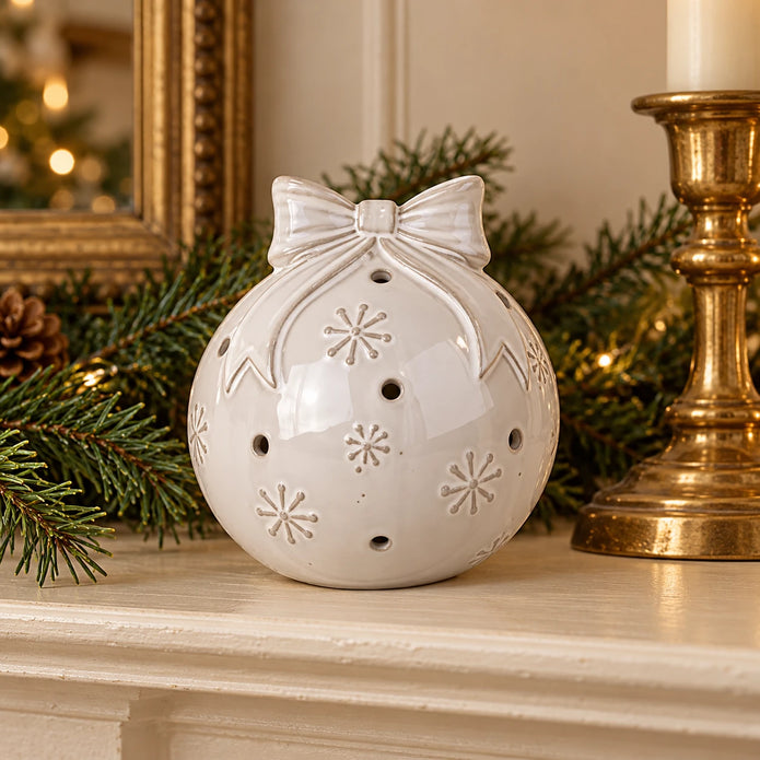 White ceramic Christmas bauble with bow and snowflake detail - small mantel