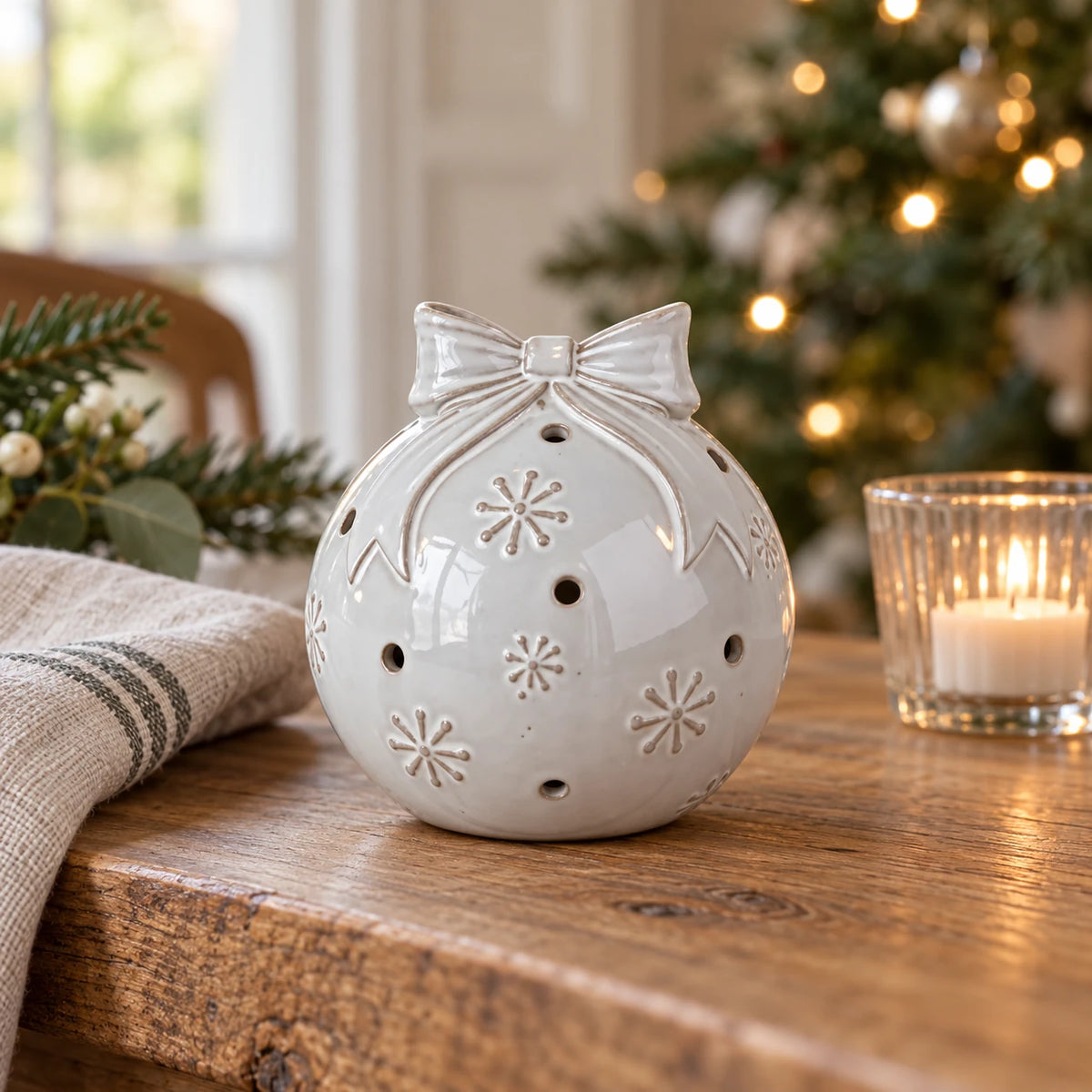 White ceramic Christmas bauble with bow and snowflake detail - small table
