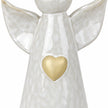 White studio close-up of the pale gold heart detail and glossy pearly glaze on the ceramic angel ornament.