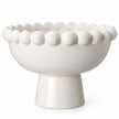 White Ceramic Bobble Footed Bowl — White studio close-up of bobble rim and curved glazed bowl