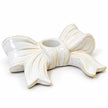 Empty white ceramic bow dinner candle holder on a clean white background