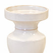 Close-up of the candle holder's shallow dish, collar and glossy white glaze
