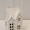 Close-up of glossy ceramic tiled roof, chimney and window details on the medium LED Christmas house