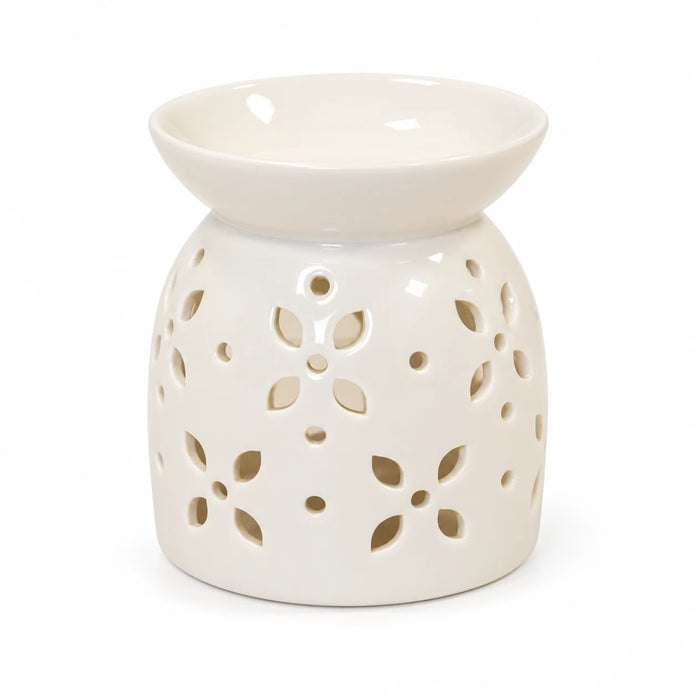 White ceramic flower-petal oil burner shown complete and empty on white