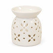 White ceramic flower-petal oil burner shown complete and empty on white