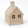 White ceramic LED light-up Christmas cottage with brickwork detail by Satchville, illuminated and cozy festive decor.