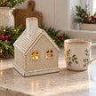 White ceramic LED light-up cottage decoration for Christmas, featuring a charming cottage design by Satchville.