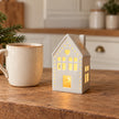 White ceramic Gainsborough Giftware x Portland Living small LED Christmas house with heart detail