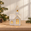 White ceramic LED church Christmas decoration by Satchville, illuminated with soft lights, perfect for holiday decor.