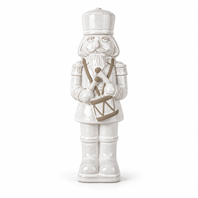 33cm large white glazed ceramic nutcracker drummer shown in full against a white studio background