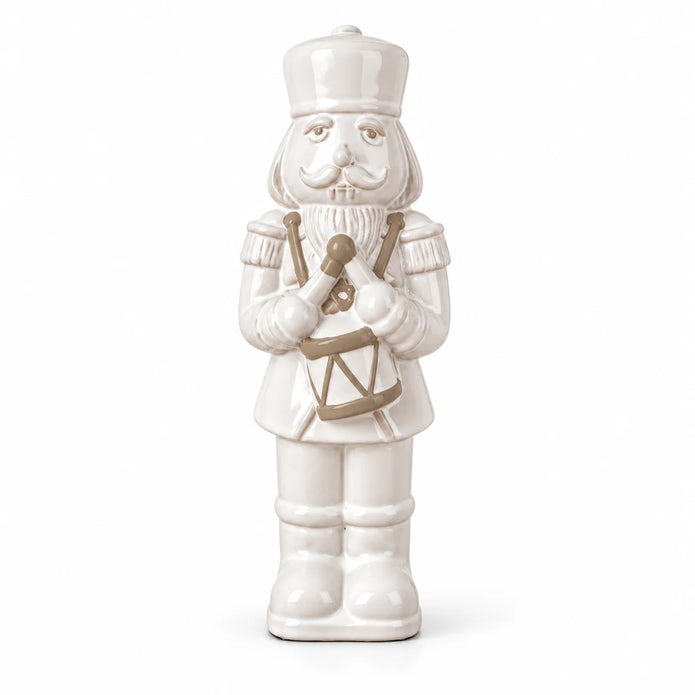 26cm medium white glazed ceramic nutcracker drummer shown in full against a white studio background