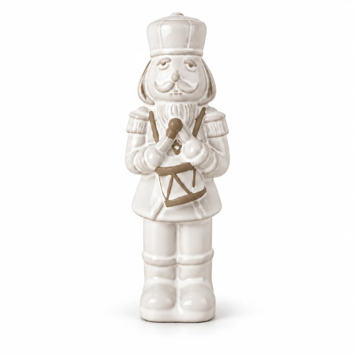 21cm small white glazed ceramic nutcracker drummer shown in full against a white studio background