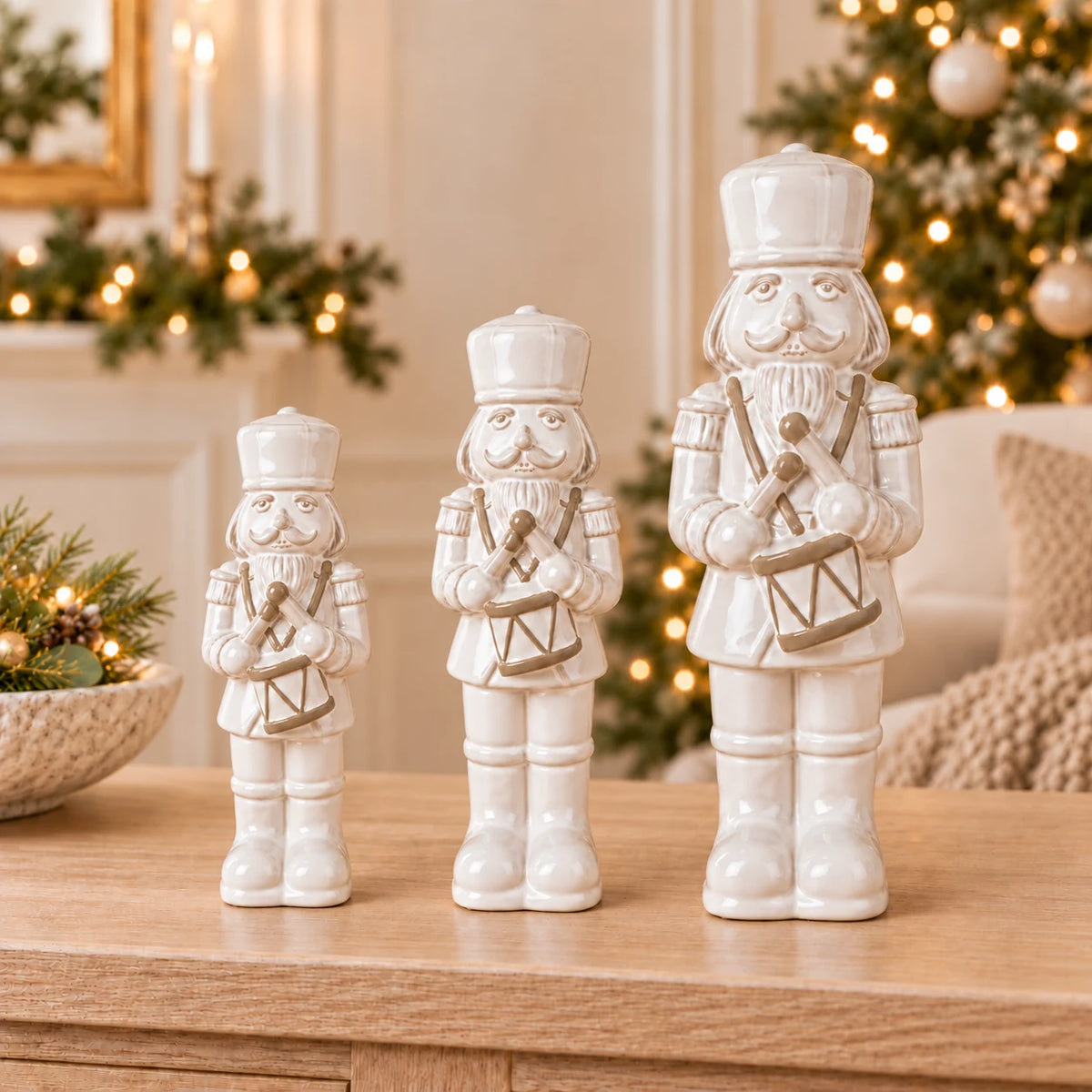 Small 21cm, medium 26cm and large 33cm white ceramic nutcrackers together; each sold separately