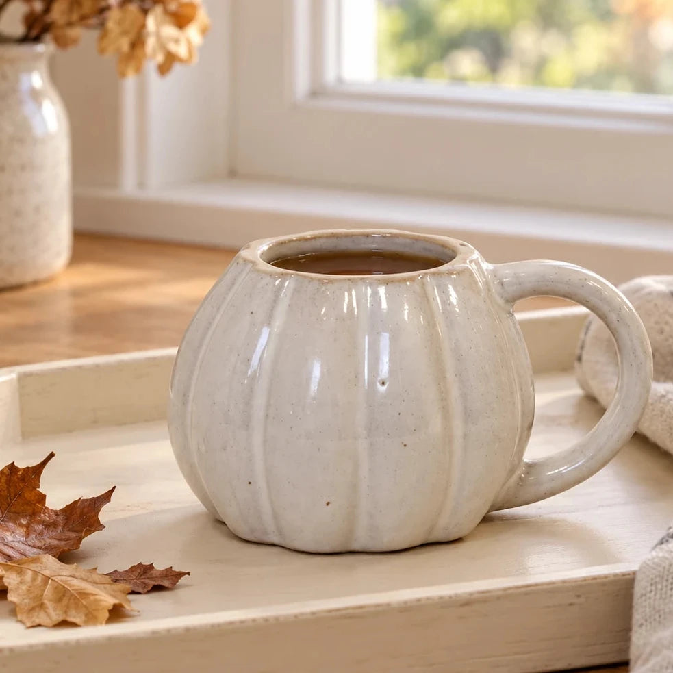 White ceramic pumpkin mug with autumn design on a breakfast tray, perfect for seasonal cozy mornings by Satchville.