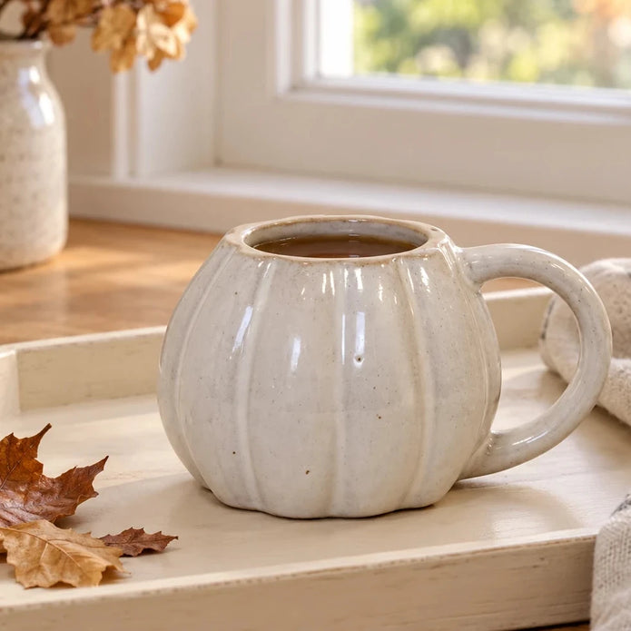 White ceramic pumpkin mug with autumn design on a breakfast tray, perfect for seasonal cozy mornings by Satchville.