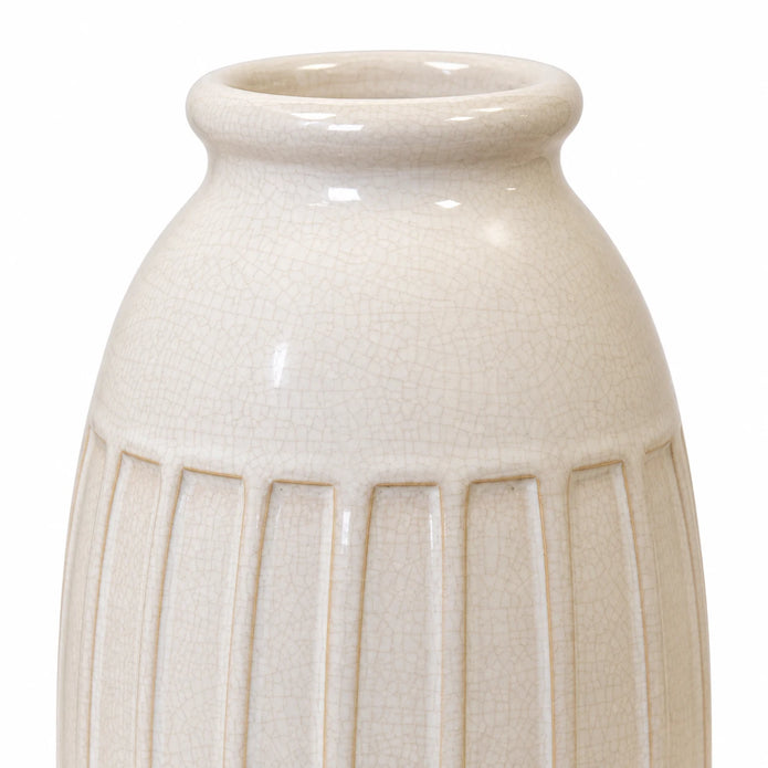 Medium white ceramic vase with ribbed texture, stylish home decor by Satchville, showcasing a smooth, rounded design.