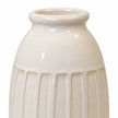 Medium white ceramic vase with ribbed texture, stylish home decor by Satchville, showcasing a smooth, rounded design.