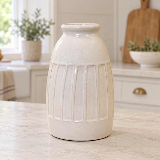 Medium white ceramic vase with ribbed texture from Satchville, ideal for home decor or floral arrangements.