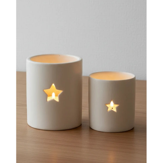 White ceramic star-shaped tealight candle holder from Gainsborough Giftware's spring collection, simple and elegant for home decor.