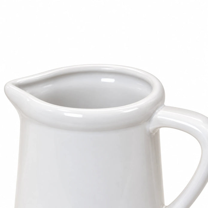 Close-up of a white ceramic small flower jug by Satchville, showcasing its smooth surface and delicate design.