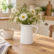 White ceramic small flower jug vase by Satchville, featuring a smooth finish and compact design for floral arrangements.