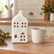 White ceramic house tealight candle holder by Satchville, large 17cm design on a kitchen scale