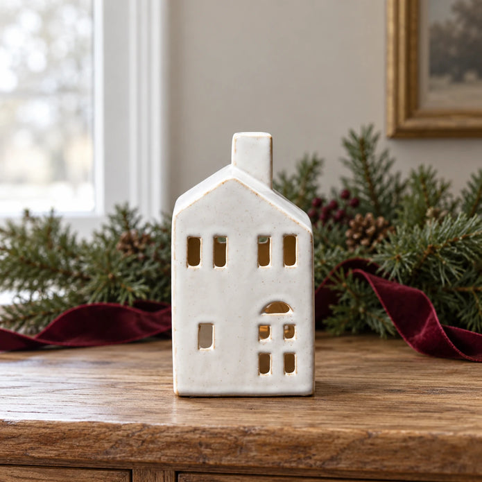 Satchville white ceramic house tealight candle holder, medium 13cm, displayed on a console table