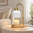 White enamel-effect candle warmer lamp in a neutral everyday living room