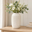 Large warm white ceramic leaf vase, 29cm tall, styled with white flowers and eucalyptus on a pale oak console.