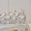 Close-up of the sculpted Christmas tree on the roof of the white glazed LED ceramic camper van