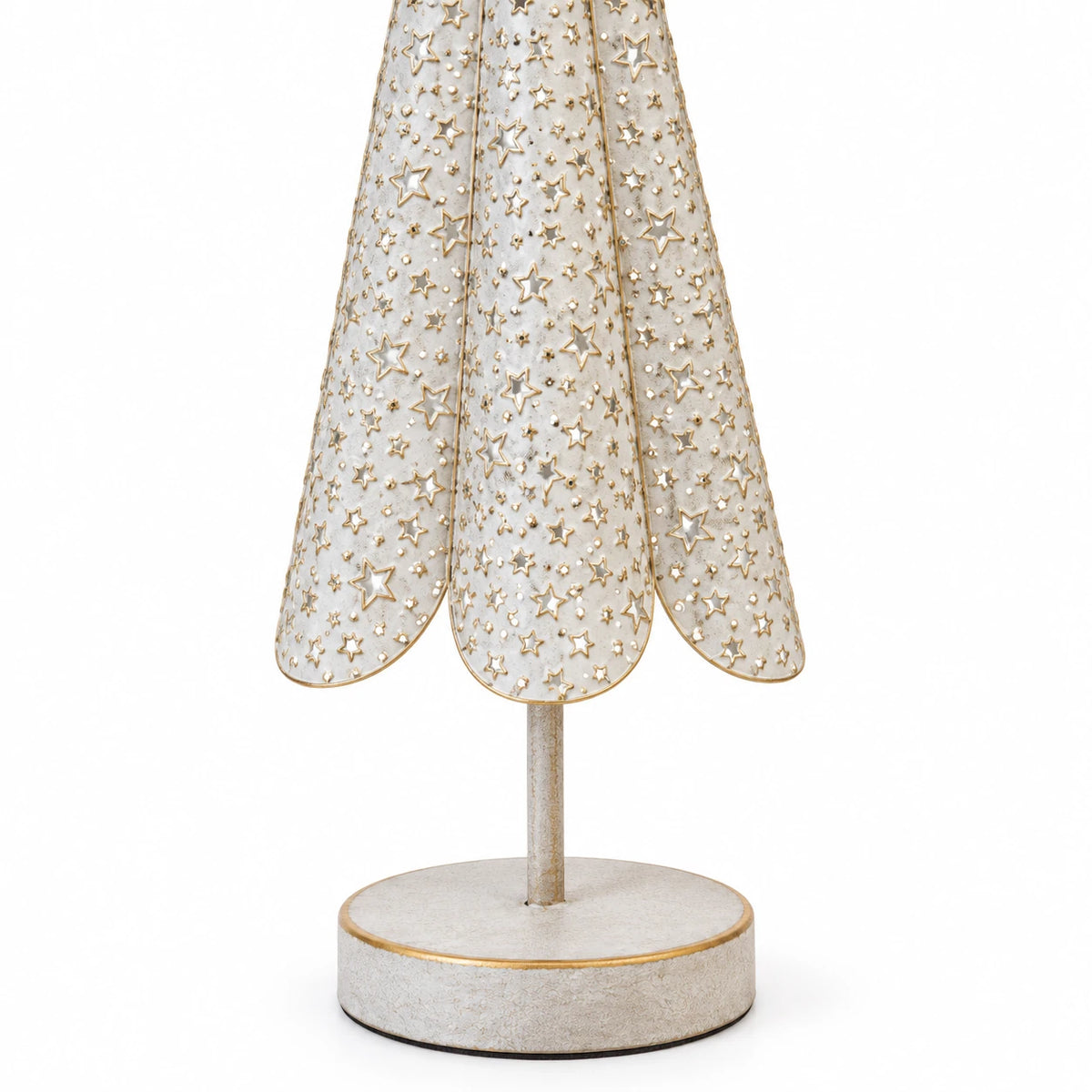 Close-up of white metal Christmas tree star pattern, scalloped edge and gold-trimmed base.